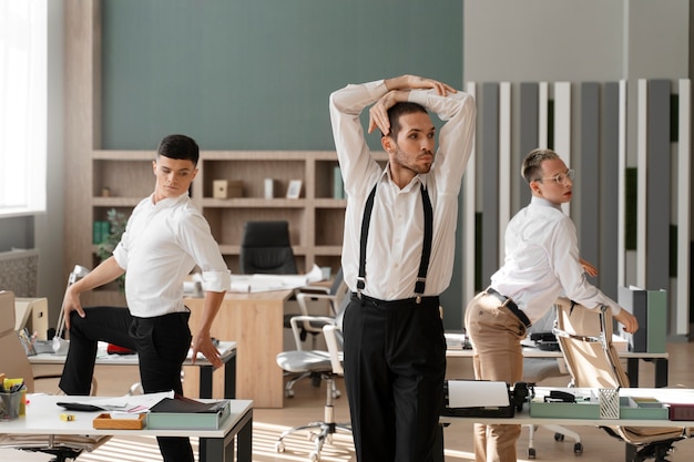 Free Photo men performing vogue dance indoors