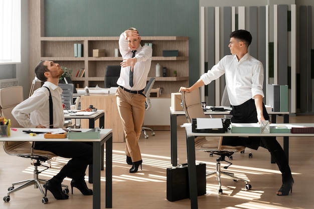 Free Photo men performing vogue dance indoors