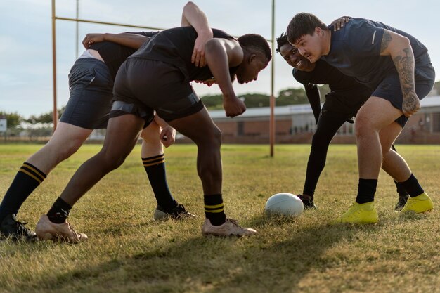 Men playing rugby on the field