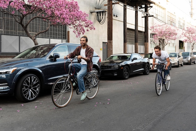 Free photo men riding bicycles in city