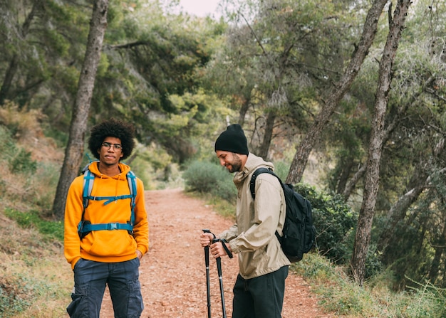 Free photo men trekking in nature