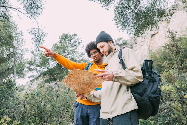 Free photo men trekking in nature