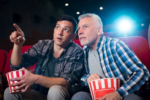 Men watching movie in cinema