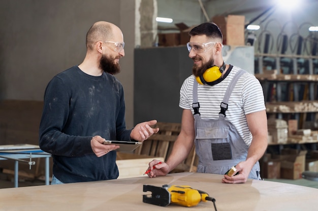 Free Photo men working on cutting mdf board