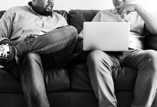 Men working on laptop