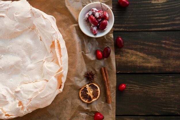 Meringue cake with rosehip and copy space