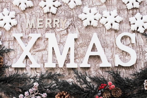 Free photo merry xmas inscription with snowflakes