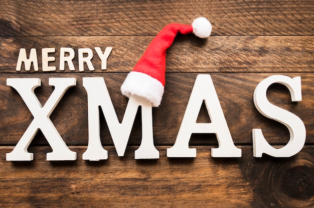 Free photo merry xmas inscription on wooden board