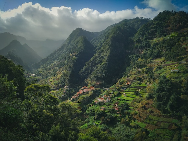 Mesmerizing scenery of a beautiful green mountains  with cloudy sky