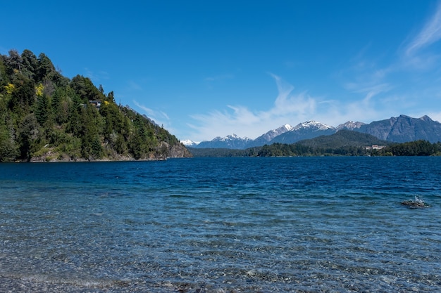 Mesmerizing shot of beaches with rocks and hidden mountainous landscapes in southern Argentina