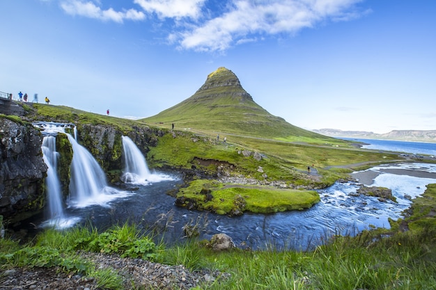 Mesmerizing shot of the famous Kirkjufellsfoss mountain and Barnafoss river in Iceland