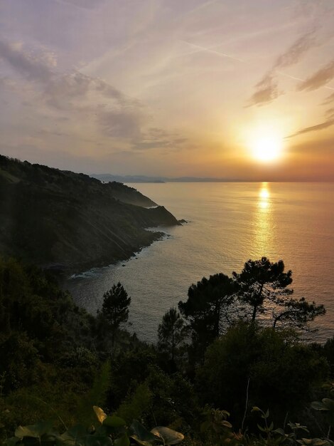 mesmerizing sunset reflecting in the ocean in San Sebastian resort town, Spain