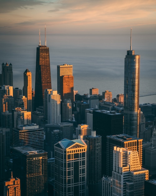 Mesmerizing view of high buildings and skyscrapers with the calm ocean