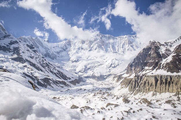 Mesmerizing view of the mountains covered in snow under a blue sky