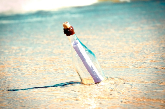 Free photo message in a bottle on the beach