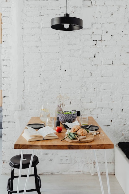 Free photo messy dining table with a book