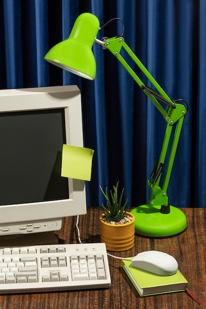 Free Photo messy office desk with old computer still life