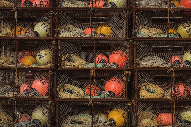 Free photo metal shelves of different colored buoys