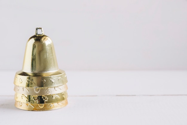 Free Photo metallic bells on white table