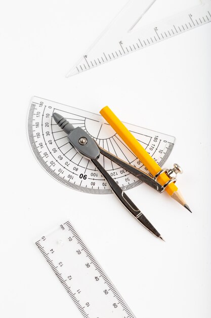 Metallic compass a top view isolated on white desk