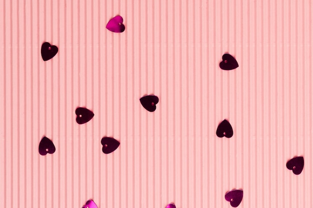 Free photo metallic heart confetti pink wallpaper