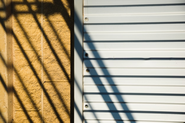 Free photo metallic wall with shadow