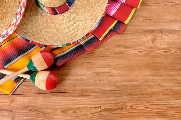 Free photo mexican elements over a wooden floor