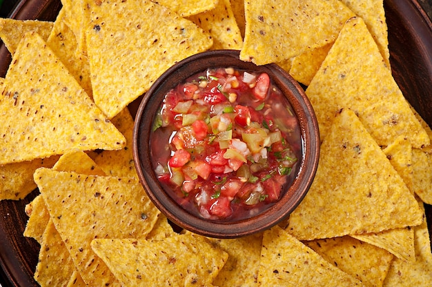 Free Photo mexican nacho chips and salsa dip in  bowl