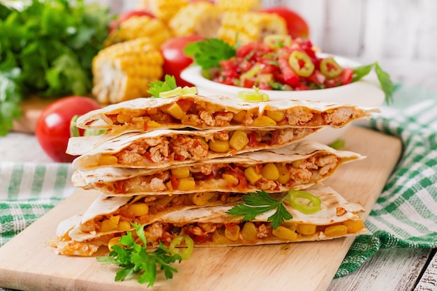 Free Photo mexican quesadilla wrap with chicken, corn and sweet pepper and salsa