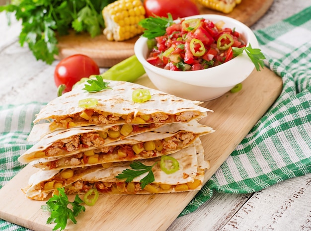 Free Photo mexican quesadilla wrap with chicken, corn and sweet pepper and salsa