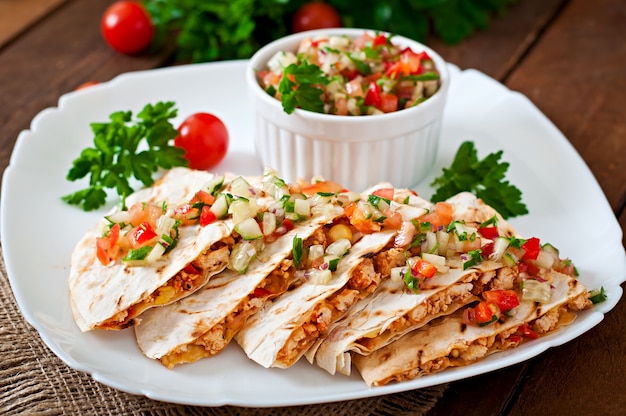 Free Photo mexican quesadilla wrap with chicken, corn and sweet pepper and salsa