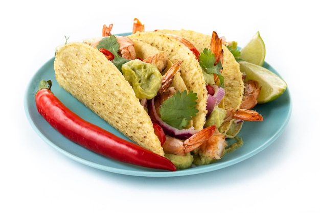 Free photo mexican tacos with shrimpguacamole and vegetables isolated on white background