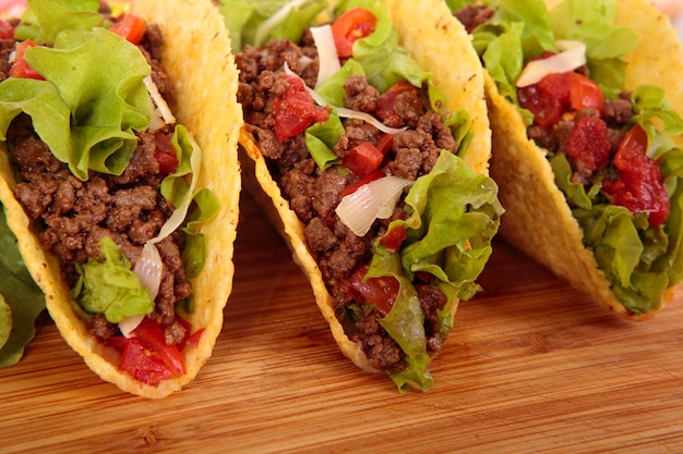 Mexican tacos on wooden table