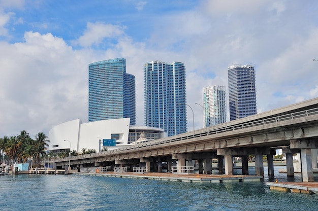 Free Photo miami skyscrapers with bridge over sea in the day.