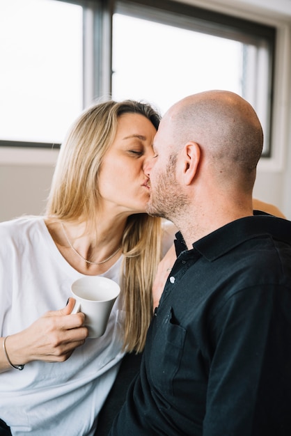 Mid aged couple in love at home