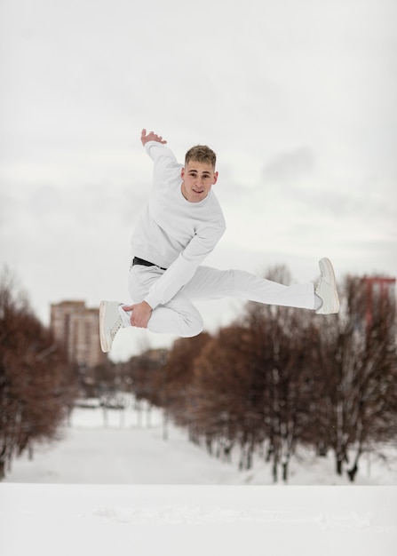 Mid-air posing by male hip hop artist