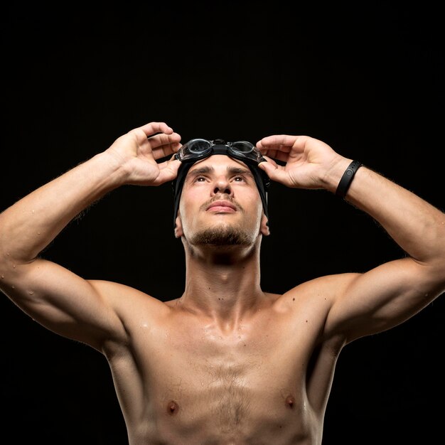 Mid shot swimmer looking up