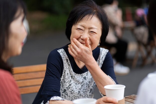 Middle age friends having fun at coffee shop