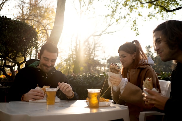 Middle age friends having fun together at picnic