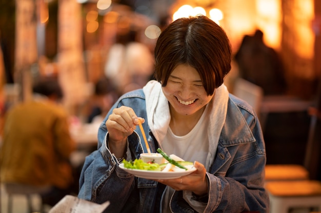 Middle age woman having fun at restaurant