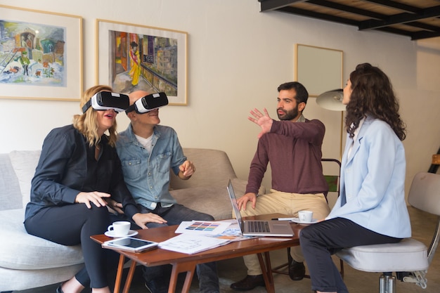 Free Photo middle aged customers enjoying vr experience