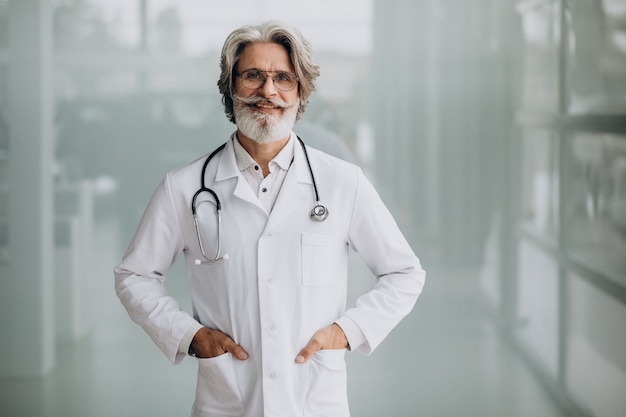 Middle aged handsome doctor in a hospital