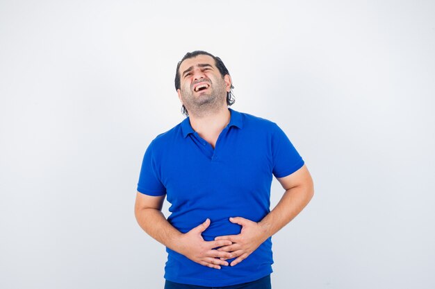 Middle aged man suffering from stomach pain