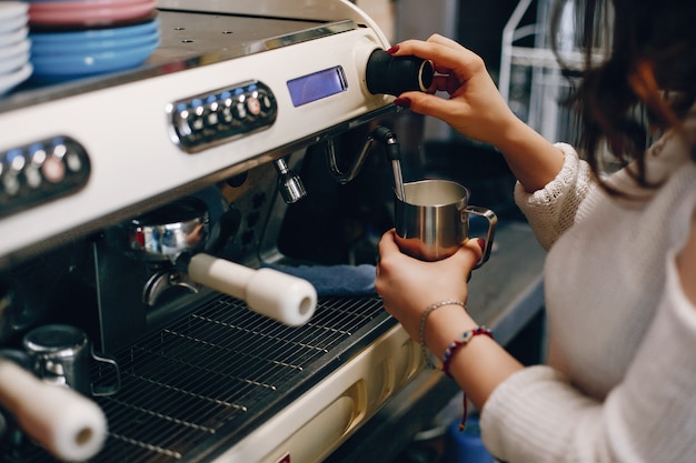 Midsection of Barista Making Coffee 