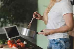 Free photo midsection of woman preparing food