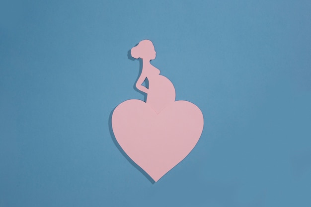 Free Photo midwives day with pregnant woman on blue background