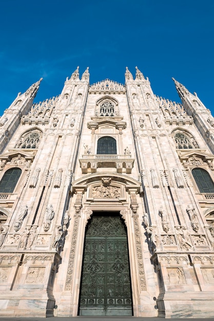 Free Photo milan cathedral door (duomo di milano), italy. dedicated to santa maria nascente