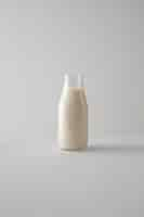 Free photo milk bottle on white background