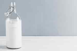 Free photo milk bottle with copy space