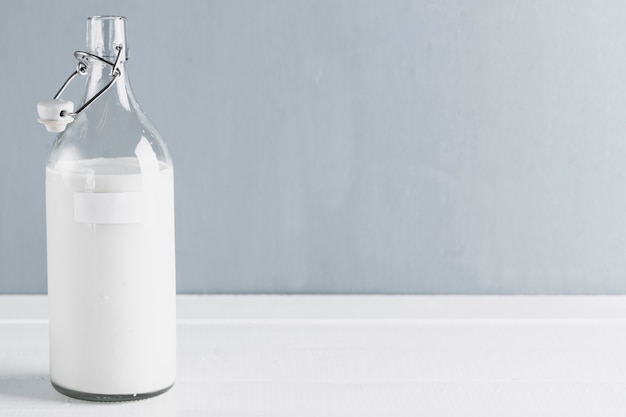 Free Photo milk bottle with copy space